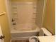 Clean bathroom with bathtub, toilet and built-in shelving at 2087 Grove Way, Hampton, GA 30228