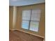 Well-lit bedroom with carpet flooring and large window at 2087 Grove Way, Hampton, GA 30228