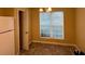 Bright dining area with large window and carpet flooring at 2087 Grove Way, Hampton, GA 30228