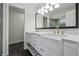 Bathroom with double vanity, farmhouse sinks, and modern gold fixtures at 265 Five Oaks Dr, Covington, GA 30014