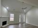 Bright living room with vaulted ceiling, fireplace, and hardwood floors at 265 Five Oaks Dr, Covington, GA 30014