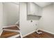 Laundry room with upper cabinets and hardwood floors at 3509 Billingsley Dr, Marietta, GA 30062