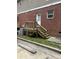 Backyard view with a wooden deck, a brick exterior, and an outdoor staircase leading to the upper level at , Marietta, GA 30008