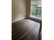 Comfortable bedroom with durable wood flooring and a large window allowing natural light at , Marietta, GA 30008