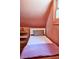 Charming bedroom featuring a cozy twin bed, painted walls and built in shelf at 10975 Hutcheson Ferry Rd, Chattahoochee Hills, GA 30268