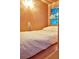 Compact bedroom showcasing a single bed with colorful stained glass window providing natural light at 10975 Hutcheson Ferry Rd, Chattahoochee Hills, GA 30268