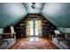 Stylish bonus room with built-in bookshelves, play area, and comfortable seating at 10975 Hutcheson Ferry Rd, Chattahoochee Hills, GA 30268