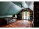 Bonus room featuring a comfortable seating area, natural light, and a calming color palette at 10975 Hutcheson Ferry Rd, Chattahoochee Hills, GA 30268