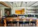 Farmhouse kitchen with a large island, green cabinets, stainless steel appliances and corrugated metal ceiling at 10975 Hutcheson Ferry Rd, Chattahoochee Hills, GA 30268