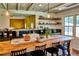 A farmhouse kitchen with a large island, green cabinets, open shelving, and a unique corrugated metal ceiling at 10975 Hutcheson Ferry Rd, Chattahoochee Hills, GA 30268