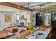 Open-concept living room with fireplace adjacent to the kitchen's wooden island and marble countertop at 10975 Hutcheson Ferry Rd, Chattahoochee Hills, GA 30268