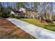 Two-story brick home with long driveway and lush landscaping at 540 Bridgewater Dr, Atlanta, GA 30328