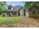 Expansive brick home featuring a well-kept backyard and neutral trim at 101 Constance Dr, Locust Grove, GA 30248