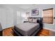 This bedroom features hardwood floors, modern décor, and ample natural light at 101 Constance Dr, Locust Grove, GA 30248