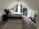 Cozy bedroom with plush carpet, a comfortable bed, and a dedicated workspace at 101 Constance Dr, Locust Grove, GA 30248