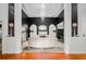 Stunning entryway with decorative lighting, dark accent wall, and stylish seating area with elegant fireplace at 101 Constance Dr, Locust Grove, GA 30248