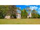 Brick house with a large backyard and lush landscaping at 101 Constance Dr, Locust Grove, GA 30248