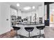 Well-appointed kitchen with stainless steel appliances, white cabinetry, and granite countertops with barstool seating at 101 Constance Dr, Locust Grove, GA 30248