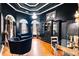 Dark and dramatic office with hardwood floors and built-ins at 101 Constance Dr, Locust Grove, GA 30248