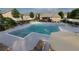 Community pool, surrounded by lounge chairs and umbrellas, offers a refreshing escape for residents at 224 Maycrest Path, Tucker, GA 30084