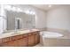 Bathroom boasts double sinks and a soaking tub at 822 Northam Ln, Atlanta, GA 30342