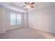 Bright bedroom with ceiling fan and carpeted floor at 822 Northam Ln, Atlanta, GA 30342