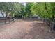 Community dog park with wood chips and waste disposal at 822 Northam Ln, Atlanta, GA 30342