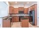 Spacious kitchen featuring dark wood cabinets and granite island at 822 Northam Ln, Atlanta, GA 30342