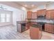 Modern kitchen with wood cabinets, granite countertops, and island at 822 Northam Ln, Atlanta, GA 30342