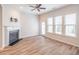 Bright living room features a fireplace, vinyl plank flooring, and sliding glass doors at 822 Northam Ln, Atlanta, GA 30342