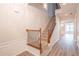 Elegant staircase with wrought iron railing and hardwood floors at 822 Northam Ln, Atlanta, GA 30342