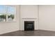 Modern gas fireplace with white mantel in living room at 1018 Blue Juniper Cir, Loganville, GA 30052