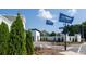 View of landscaped community entrance with flags at 1818 Butterfly Way, Marietta, GA 30066