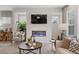 Living room with a fireplace and a large TV at 220 Maycrest Path, Tucker, GA 30084