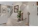 Modern staircase with dark metal railing and light wood steps at 220 Maycrest Path, Tucker, GA 30084