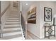 Elegant staircase with black metal balusters and hardwood floors at 220 Maycrest Path, Tucker, GA 30084
