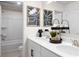 Double vanity bathroom with a shower and decorative accents at 7175 Linden Dr, South Fulton, GA 30349