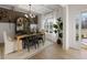 Elegant dining room featuring a wood table, chandelier, and access to backyard at 7175 Linden Dr, South Fulton, GA 30349