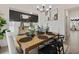 Modern farmhouse dining room with wood table and neutral color palette at 7175 Linden Dr, South Fulton, GA 30349