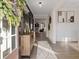 Bright entryway with hardwood floors, decorative console table, and view to living room at 7175 Linden Dr, South Fulton, GA 30349