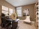 Bright home office with built-in shelving and window seat at 7175 Linden Dr, South Fulton, GA 30349