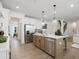 Open concept kitchen with island, stainless steel appliances, and hardwood floors at 7175 Linden Dr, South Fulton, GA 30349