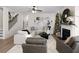 Spacious living room featuring a cozy fireplace and large sectional sofa at 7175 Linden Dr, South Fulton, GA 30349
