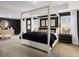 Large main bedroom with a four poster bed and dark walls at 7175 Linden Dr, South Fulton, GA 30349