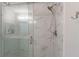 Large walk-in shower with marble tile and glass door at 1339 Stillwood Ne, Atlanta, GA 30306