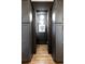 Elegant powder room with dark walls, hardwood floors, and a chandelier at 1731 N Springs Dr, Dunwoody, GA 30338