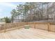 Wooden deck overlooking backyard with treeline views at 42 Oak Leaf Dr, Dallas, GA 30157