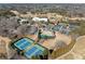 Aerial view showing tennis courts, pool, and clubhouse at 110 Pro Ter, Johns Creek, GA 30097