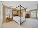 Spacious bedroom with a four-poster bed and ample natural light at 110 Pro Ter, Johns Creek, GA 30097