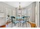 Breakfast nook with glass-top table and window seats at 110 Pro Ter, Johns Creek, GA 30097